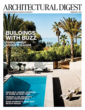 Architectural Digest’s February 2017 cover featuring a modern poolside retreat surrounded by palm trees with an ocean view.