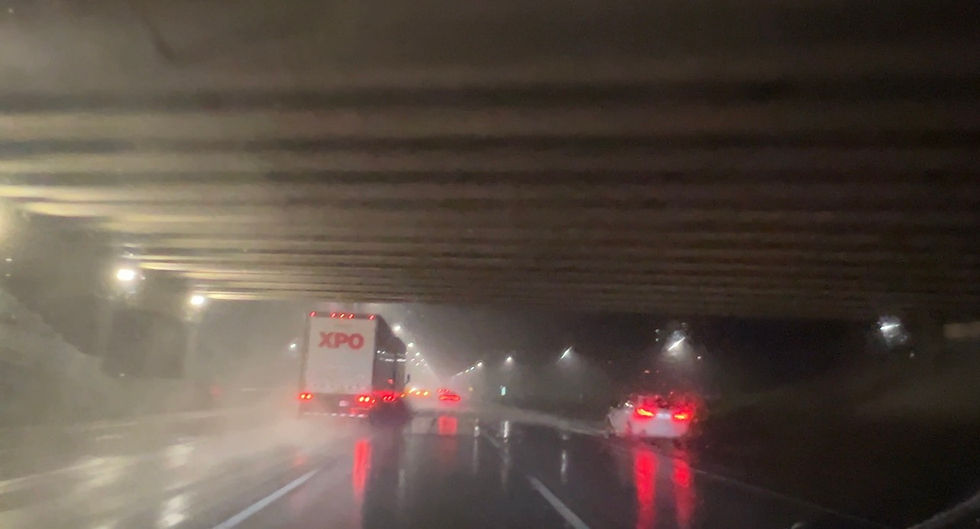 Car Parked Under a Bridge on an Interstate Highway - Photo: © RoadTour.Net