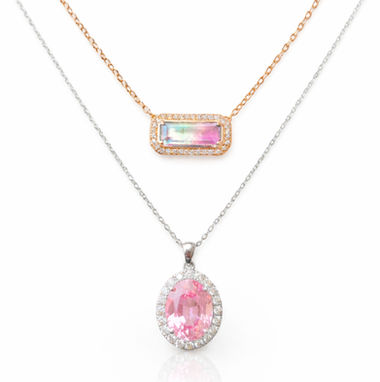 Rose gold necklace set with a watermelon tourmaline and a pave diamond halo
Pink tourmaline with a diamond halo