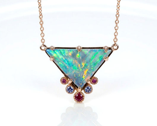 Australian Opal pendant in rose gold set with ruby and tanzanite.