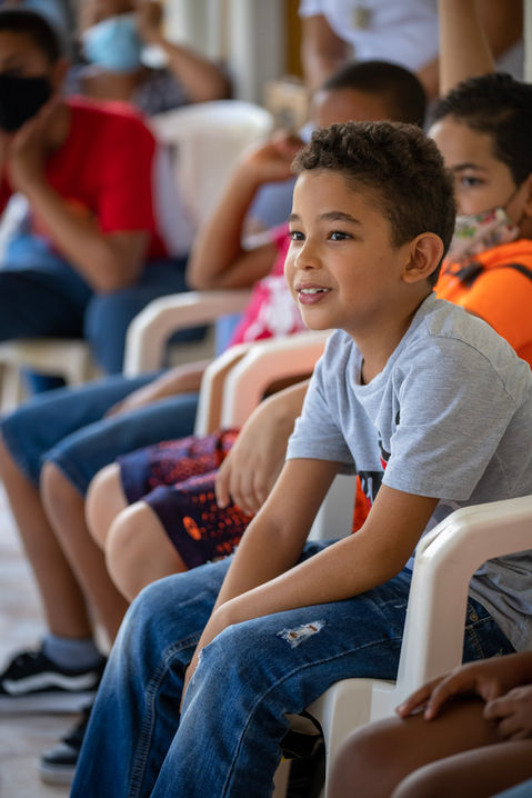 Little boy listening in on WASH education