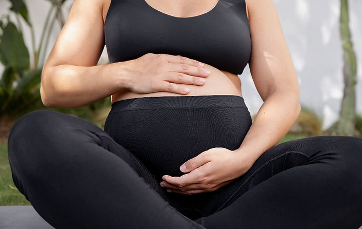 close-up-young-pregnant-woman-doing-yoga_edited.jpg