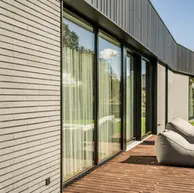 Clean-lined home exterior featuring Misty Morning thin brick cladding