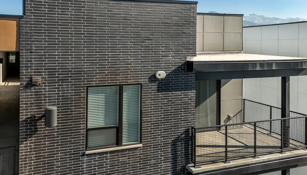 Streetcar Flats in Salt Lake City Utah are accented with Black Beauty thin brick in Norman size. This is a view of the thin brick up close from an angle.