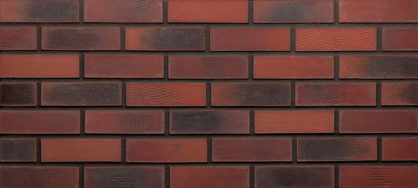 traditional red and charcoal industrial brick with dark grout