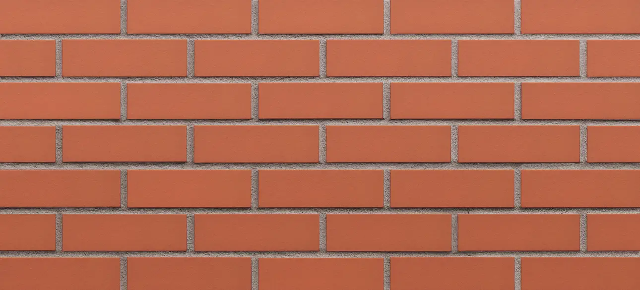 Ruby Red modular size thin brick veneer featuring sleek red bricks with a smooth, consistent finish