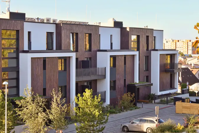 Modern apartment buildings with white and brick exterior finishes
