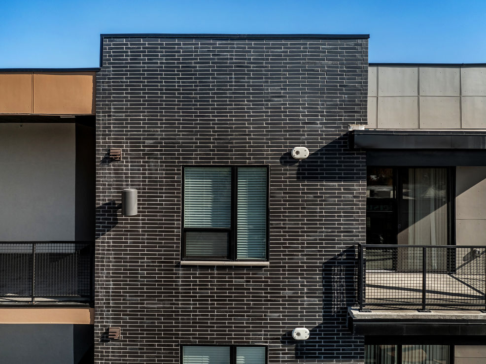 Streetcar Flats in Salt Lake City Utah are accented with Black Beauty thin brick in Norman size. This is a view of the thin brick up close.