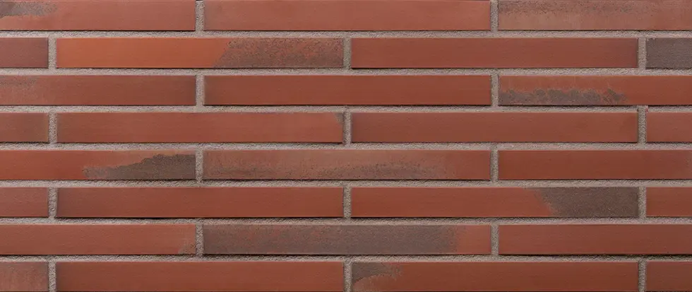 Red Zeppelin Euro Imperial thin brick veneer featuring long-format red bricks with soft brown and charcoal variation