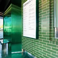 Green Valley Glazed thin brick in King Size installed on service counter and surrounding walls at Formula Fig LA.