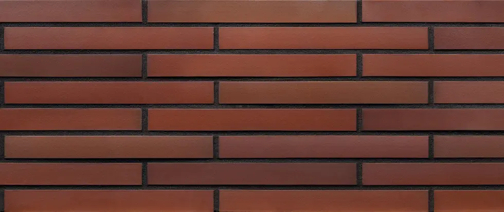 Tibetan Flame Euro Imperial thin brick veneer featuring long-format red and terracotta bricks with subtle tonal variation