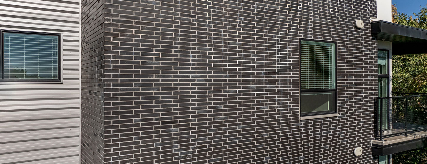 Streetcar Flats in Salt Lake City Utah are accented with Black Beauty thin brick in Norman size. This is a view of the thin brick up close.
