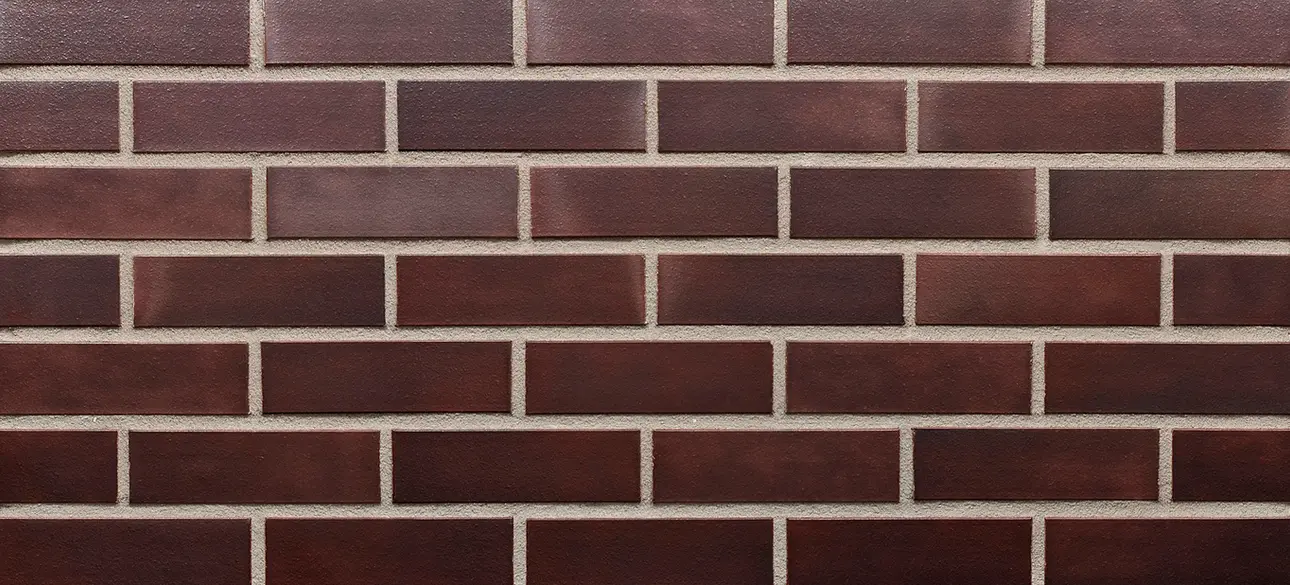 King Crimson Modular Size thin brick veneer with deep red bricks and a smooth matte finish