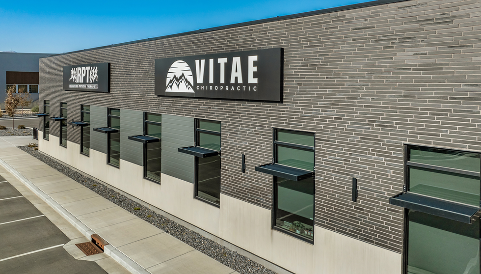 Black Beauty thin brick in imperial size was chosen to cover the facade of this medical office building where RPT, Registered Physical Therapists, Vitae Chiropractice and Family First Pediatric Dentisty and Orthodontics reside in West Jordan, Utah. Photo of front at angle. 