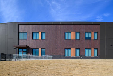 Educational building exterior with brickwork and metal framing