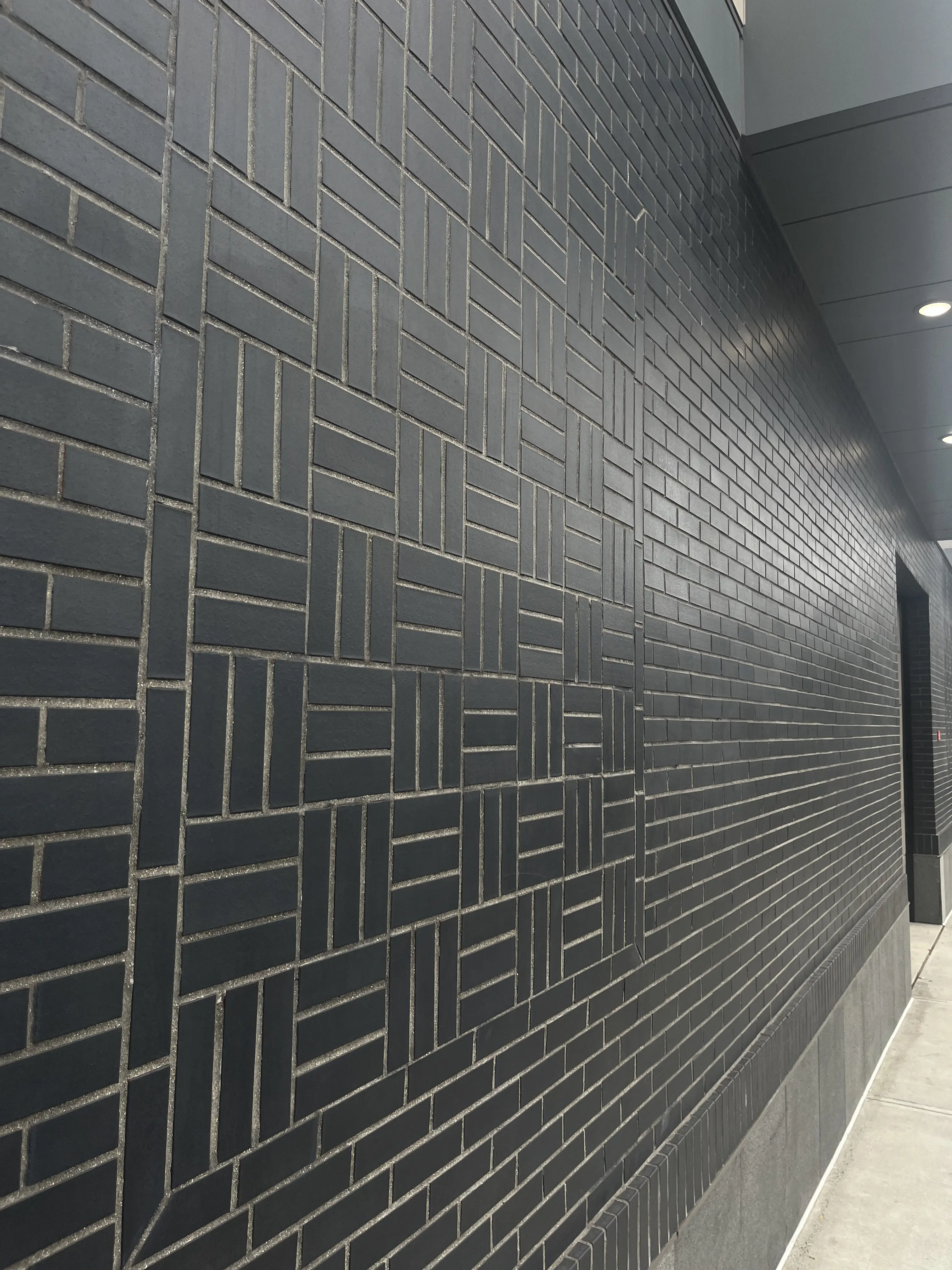 Patterned Manganese brick adds texture and visual interest.