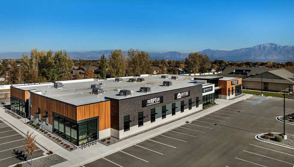 Black Beauty thin brick in imperial size was chosen to cover the facade of this medical office building where RPT, Registered Physical Therapists, Vitae Chiropractice and Family First Pediatric Dentisty and Orthodontics reside in West Jordan, Utah. Photo of front at angle with wide view of mountains.