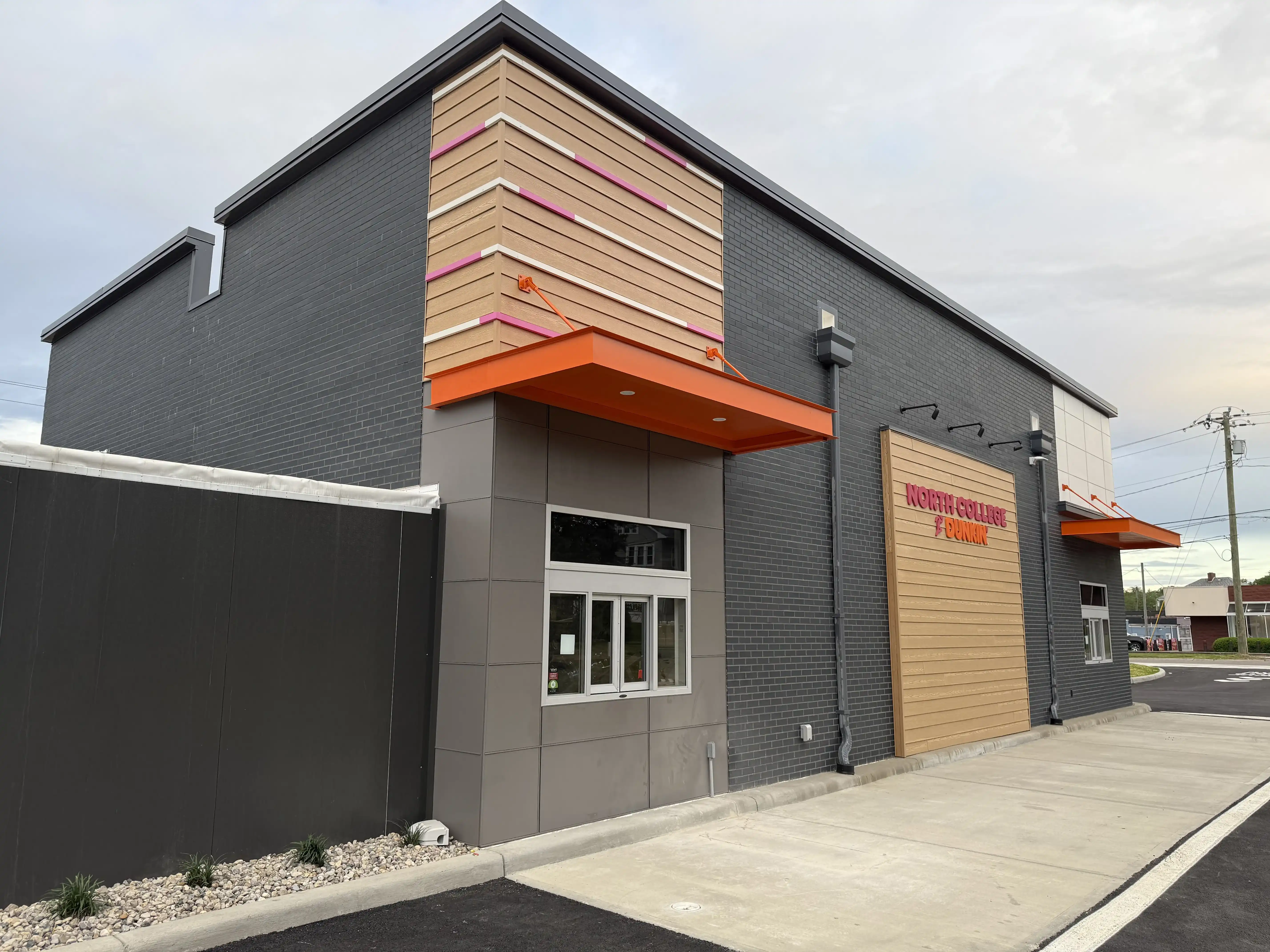 Manganese thin brick creates a modern backdrop for bold brand colors.