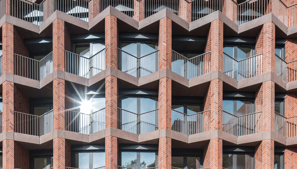 Bernardyńska 4, Wroclaw, Poland, Custom Thin Brick, front of building with sun glare