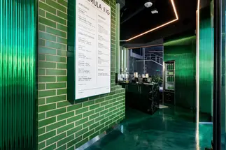 Contemporary commercial interior featuring Green Valley Glazed thin brick in King Size at Formula Fig Los Angeles.