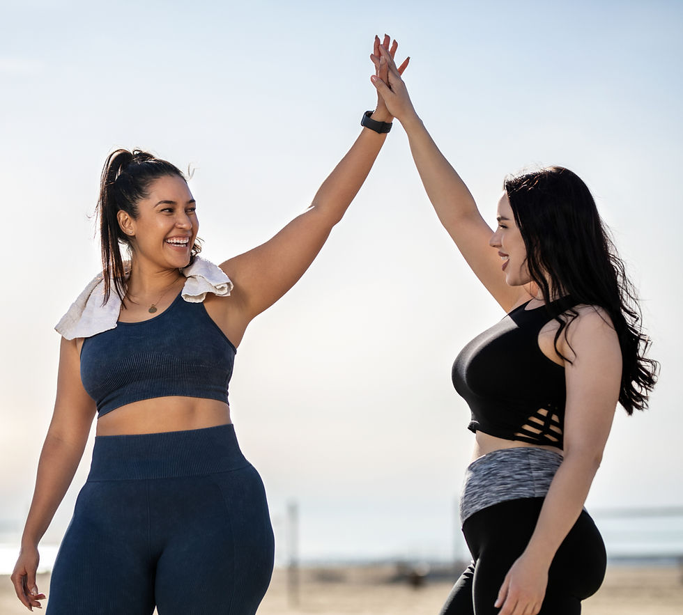Women High-Fiving Outdoors
