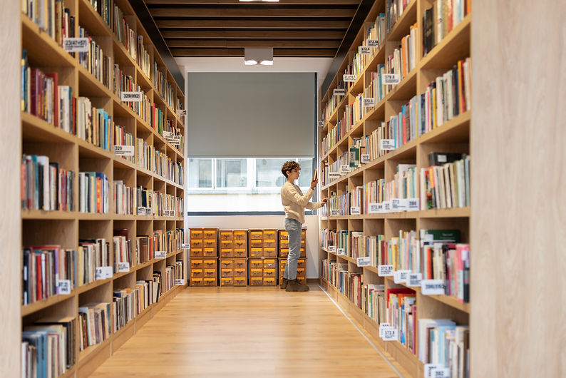 young-student-looking-book-library.jpg