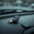a car key fob on a matte black dashboard, dark themed scenery.jpg