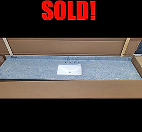 Image of a gray & white sink top in a box. Text: SOLD!