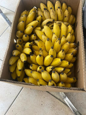 Box of ripe yellow bananas