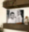 A photo mounted on canvas of two young brothers having a laugh together