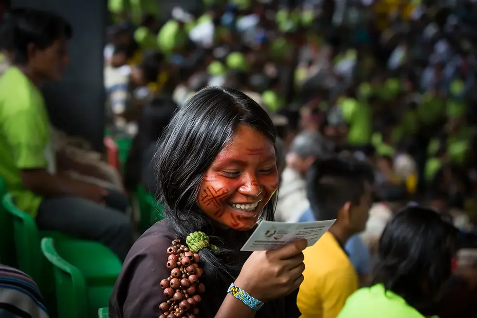 Indigenous woman reading and smiling