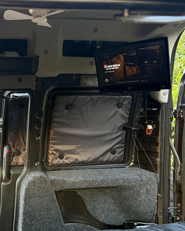 Inside my Campervan with my TV and Black out blinds