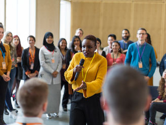 A leader presenting ideas during a team meeting