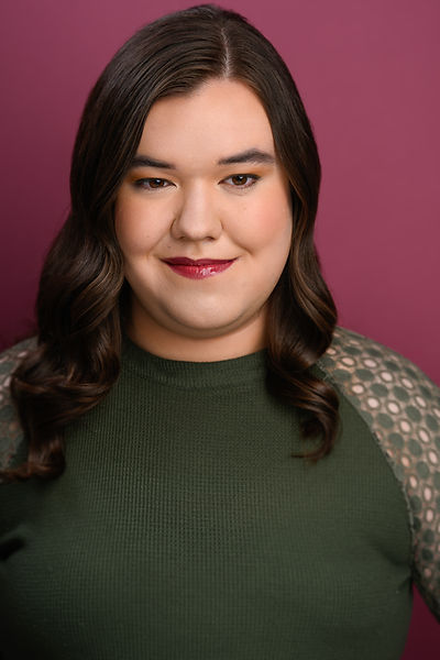 Alternate Headshot for actress Ryanne Parker, wearing a green shirt on a purple background