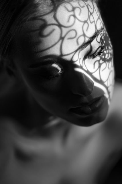 a black and white beauty photo portrait with a lot of strange shadows on the face of the model Veroni