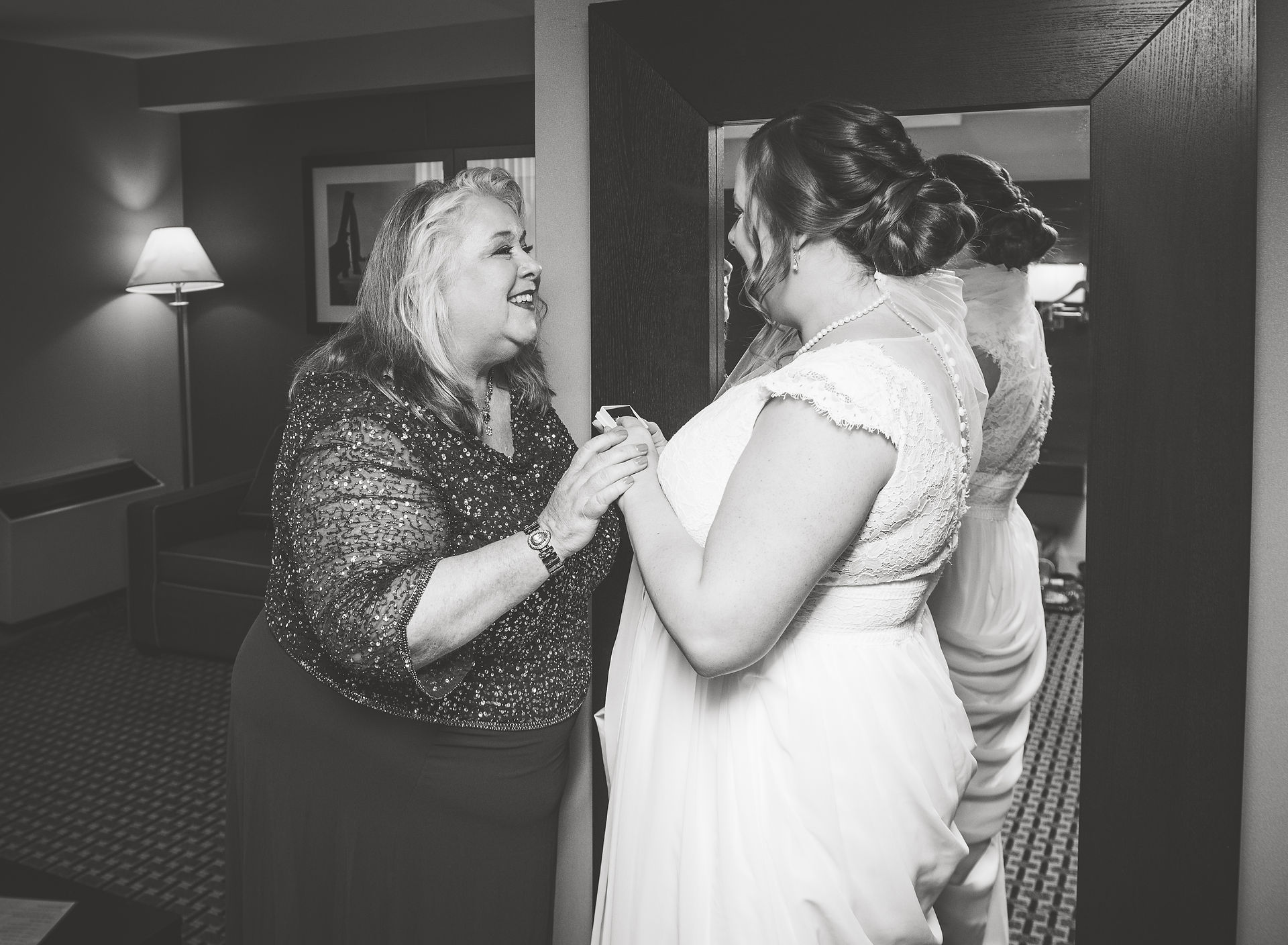 bride and her mother share a moment after a gift exchange