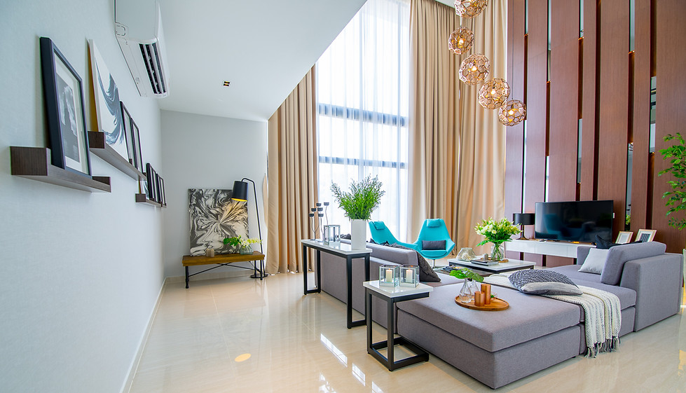 living room space with high ceiling, feature wall in tiber cladding, modern grey sofa, beige floor and pendant lights