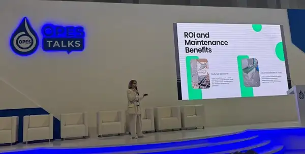 Summer speaking on stage at OPES Talks in Oman