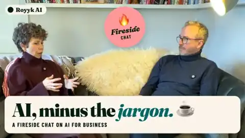 Summer and Peter on a sofa in the AI, minus the jargon fireside chat