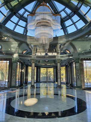 customised chandelier under a glass dome during a sunny day