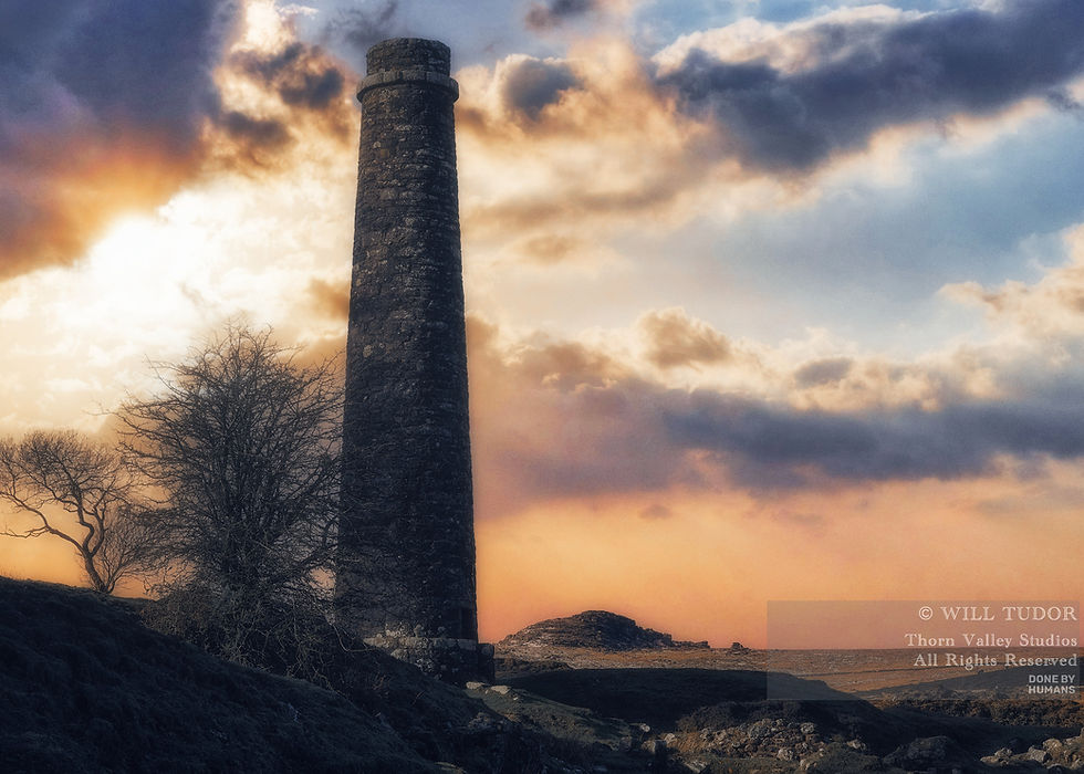 Tall stone chimney ruin against glowing sunset clouds, with bare trees and a Thorn Valley Studios watermark.