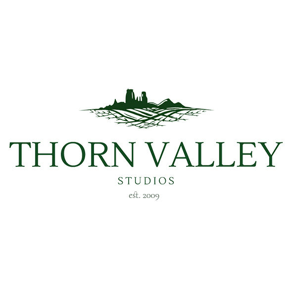 Green Thorn Valley Studios logo with landscape icon and est. 2009 on a white background