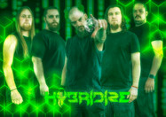 Band Hybrid2d posing in front of green background, portraits, Thorn Valley Studios.