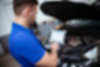 car-mechanic-with-laptop-hand-conducts-computer-diagnostics-errors-car-systems.jpg