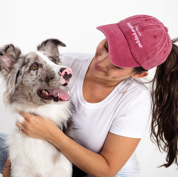dog and a woman with a dog mom cap