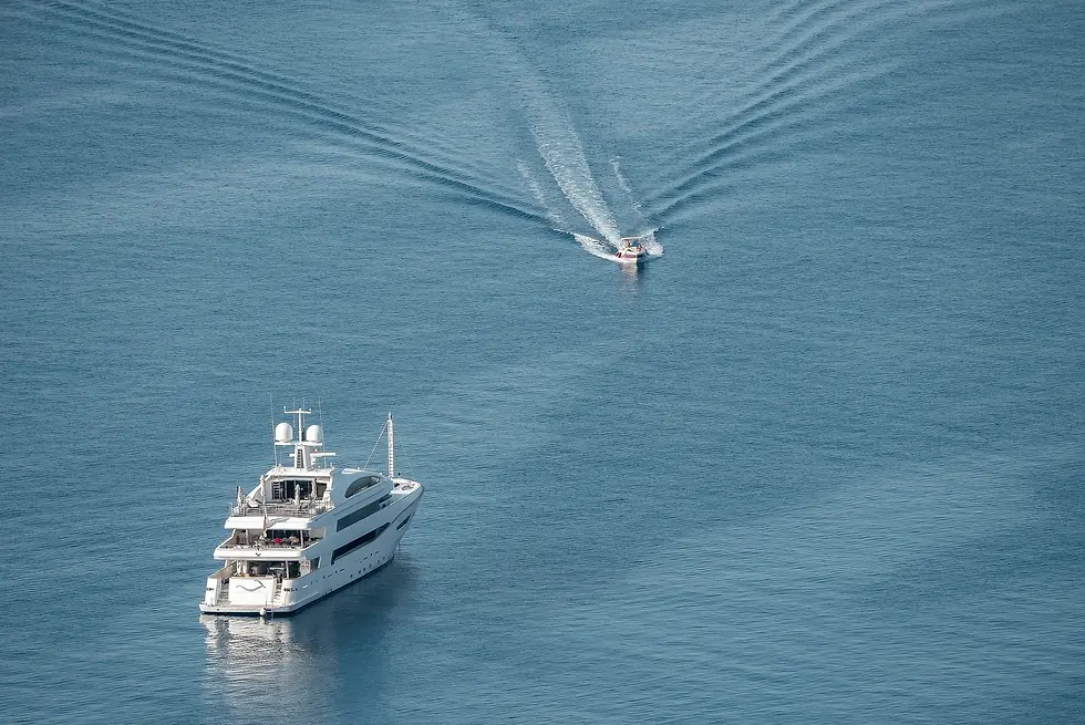 large-vecteezy_high-angle-view-of-motor-boat-moving-by-luxurious-yacht-on_12201771_large.w