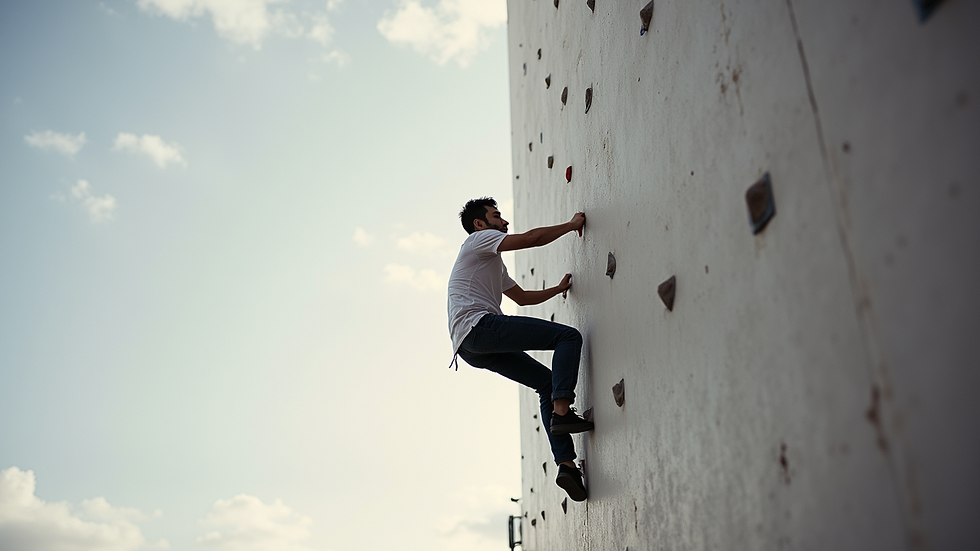 Eye-level view of a person performing wall climbing exercise against a plain wall