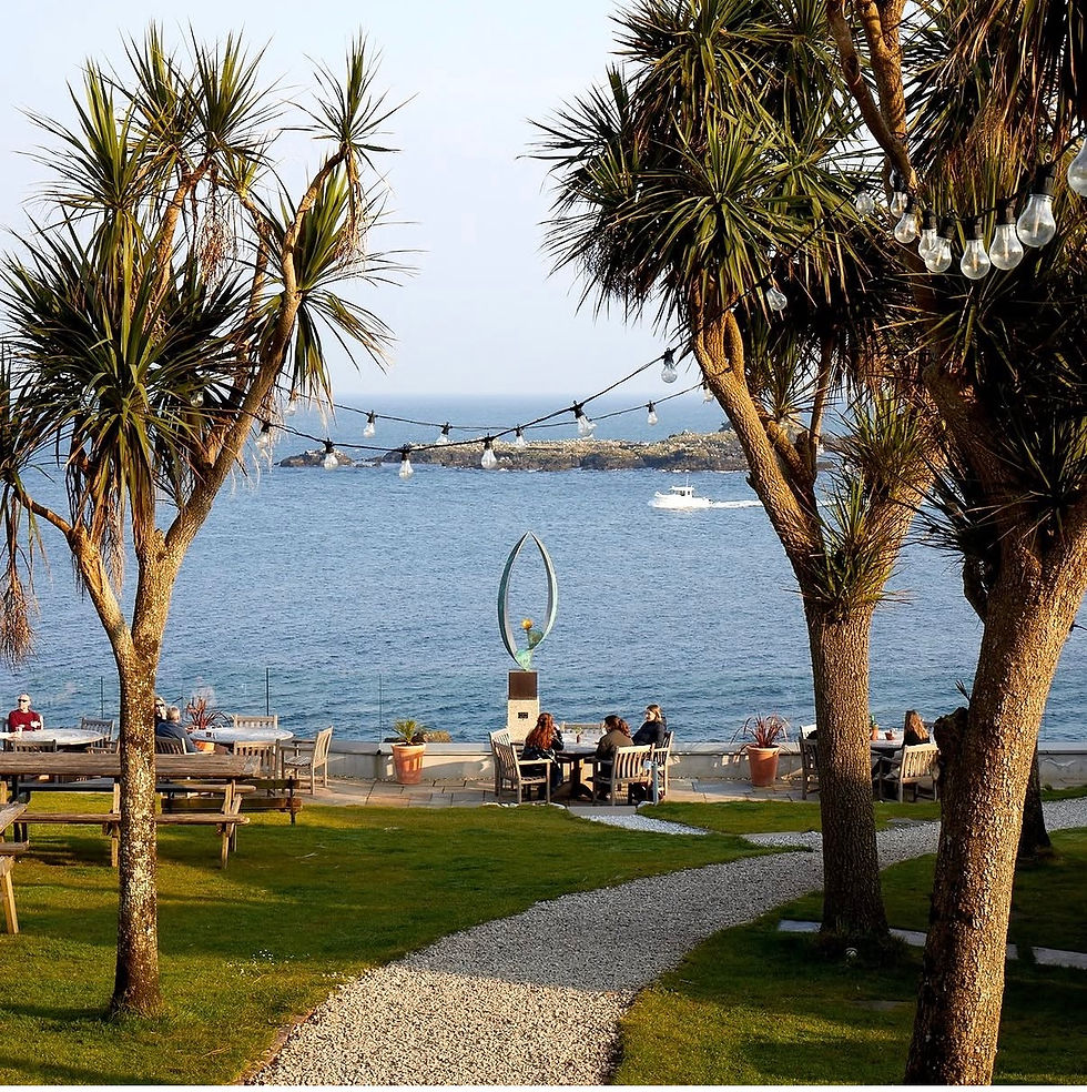 The place for sundowners in Cornwall: the garden over looking the sea at The Old Coastguard Mousehole