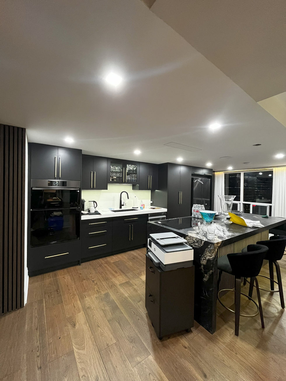Kitchen with brown floors in North York Penthouse mad by pearl knstructions