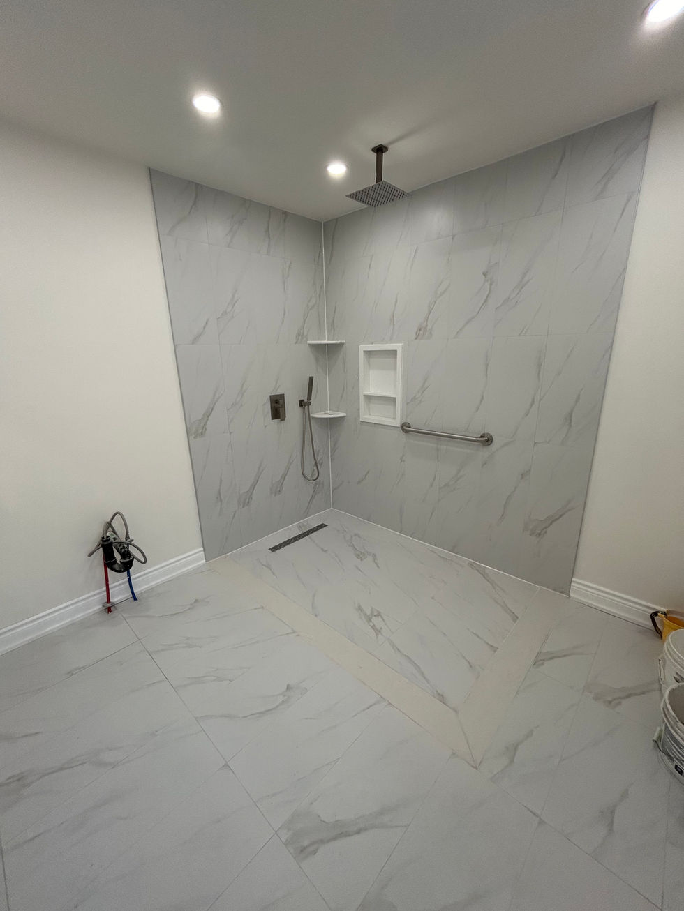 White tiled stand-up shower